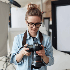 Female Photographer looking at camera.
